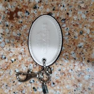 White leather coach bag charm